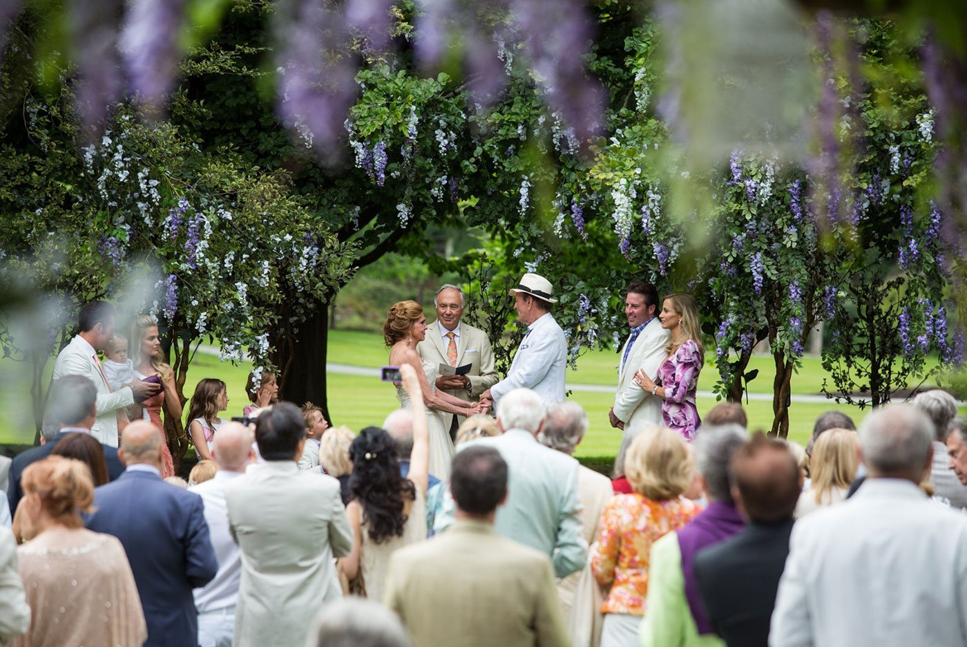 A dreamy enchanted garden wedding setup at VanDusen, featuring lush florals and elegant greenery.