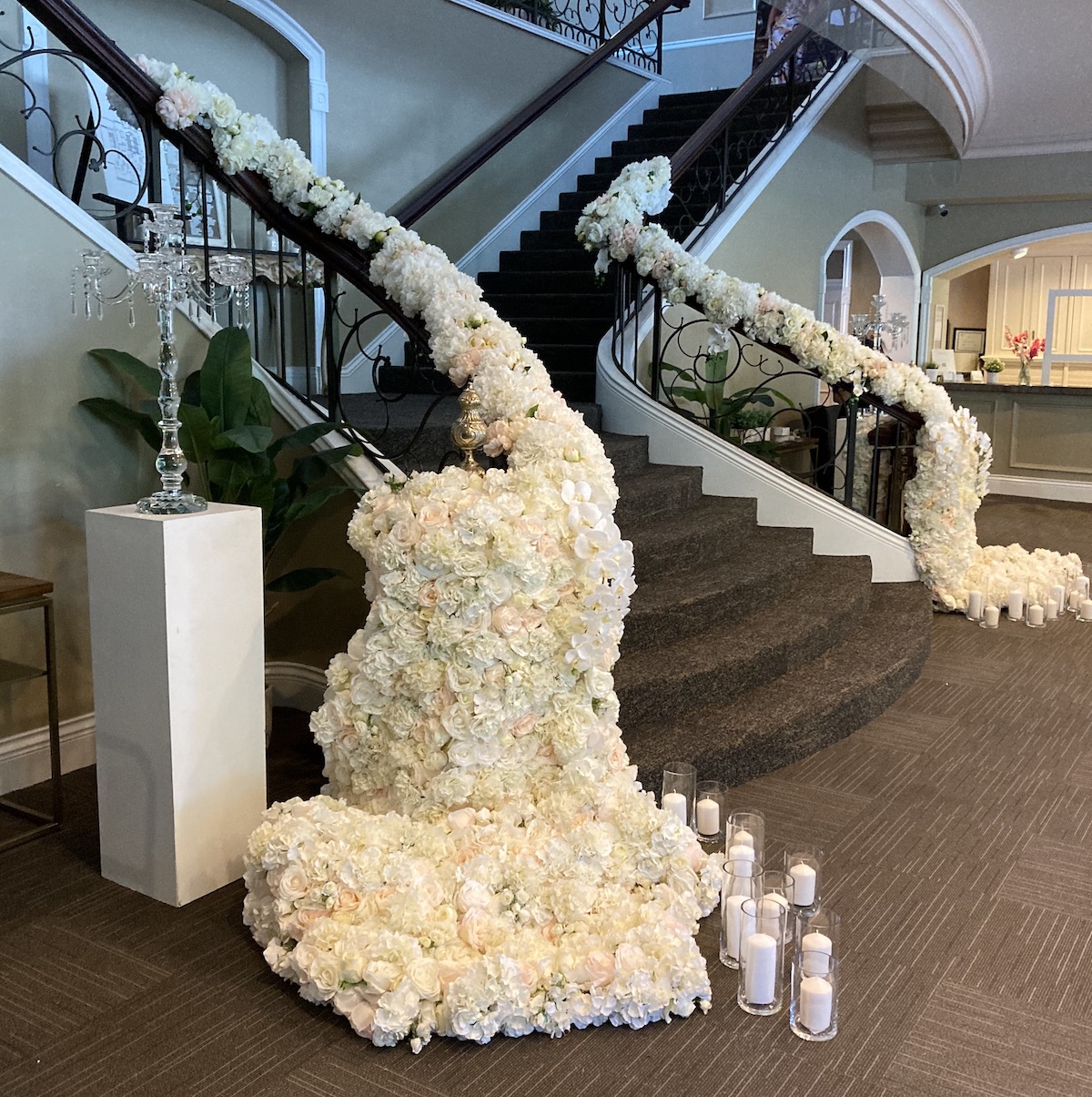 custom florals on a staircase railing spilling onto the floor