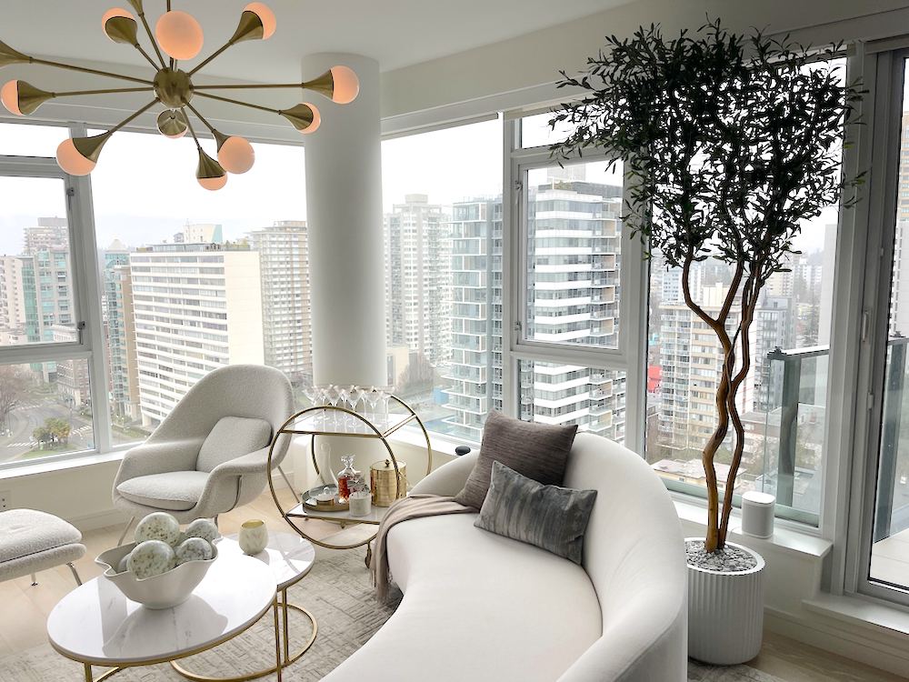 Artificial Olive tree in a decorative grey pot in a residential condo living room