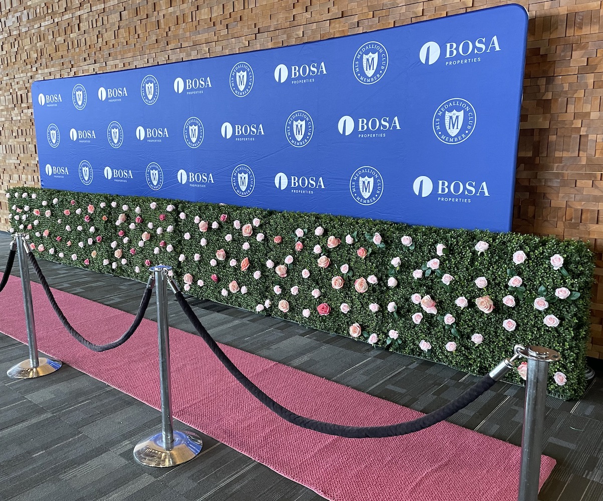 Artificial boxwood with florals step and repeat rental by Greenscape Design for Bosa Properties in Vancouver.