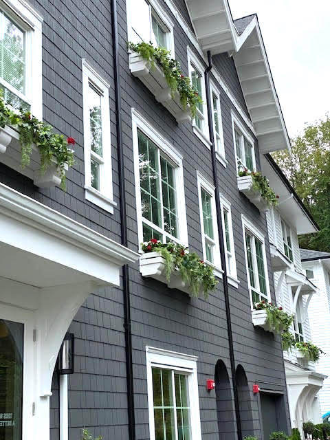 Artificial greenery in window boxes of a condo building
