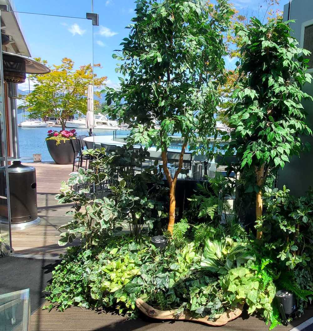 Exterior replica West Coast tree vignette on a patio for a corporate event.