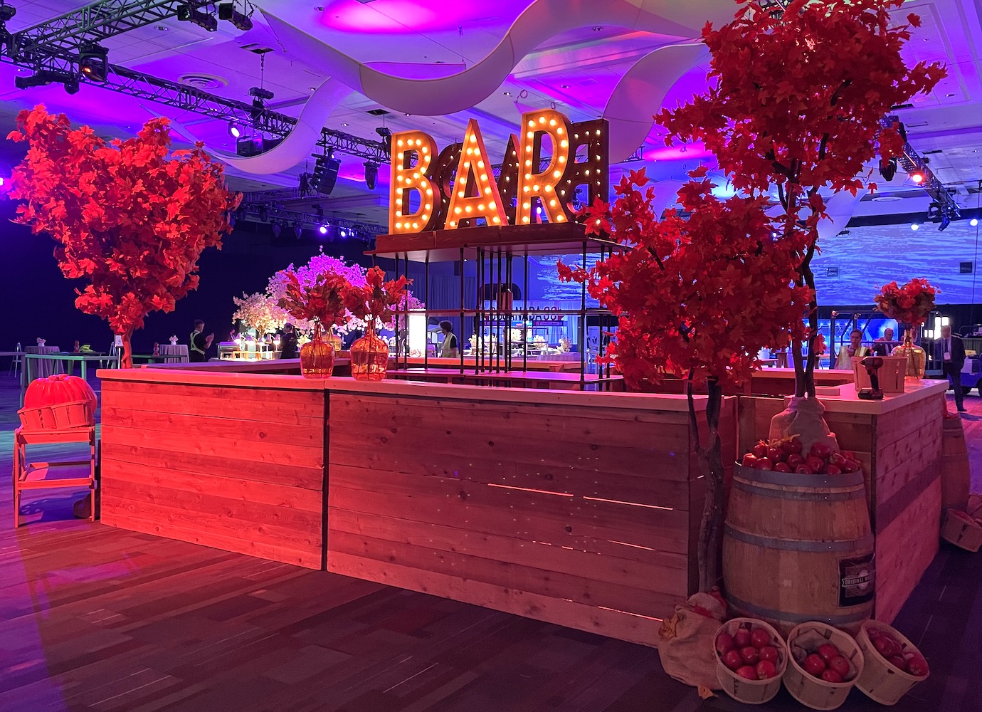 Fall Harvest Tree bar decor by Greenscape Design featuring maple trees, pumpkins, gourds, and harvest baskets.