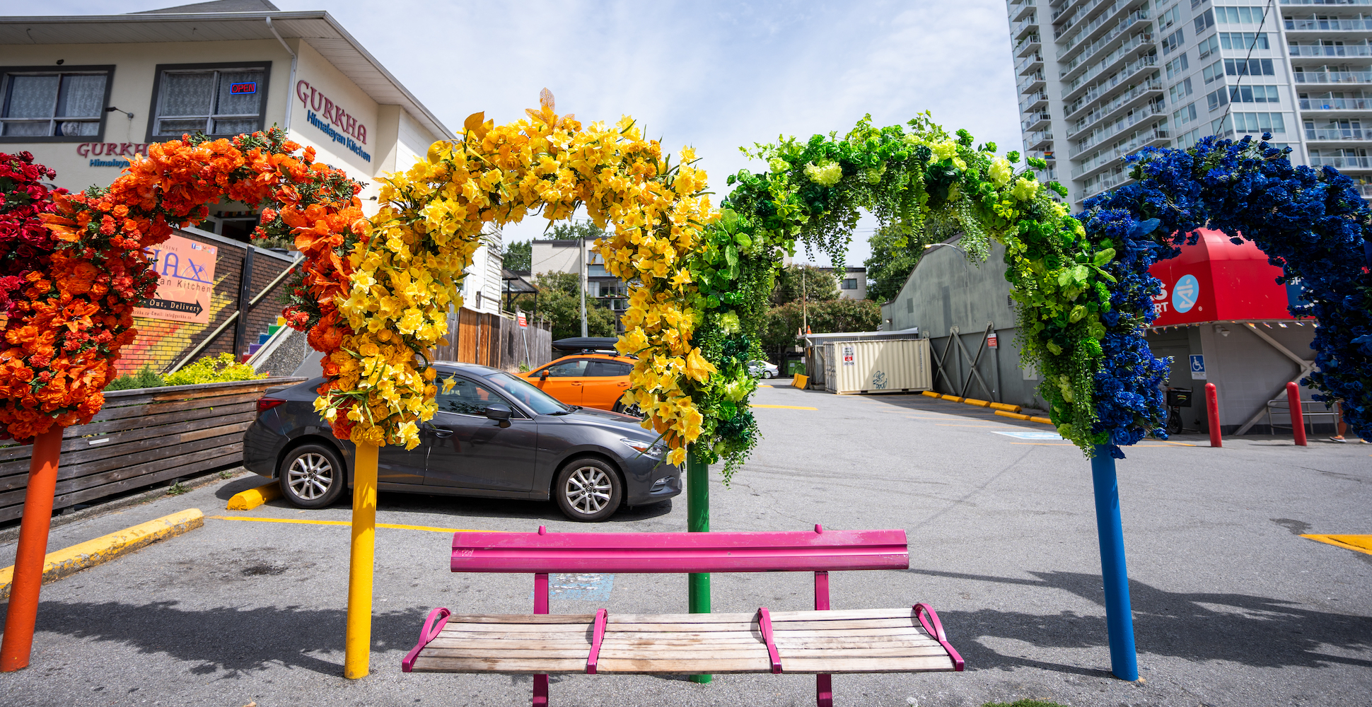 Vibrant floral display showcasing a rainbow spectrum at Fleur de Villes in Vancouver.