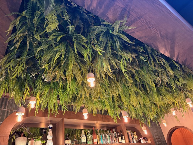 Artificial greenery ceiling decor by Greenscape Design in the Havana Flamingo Room.