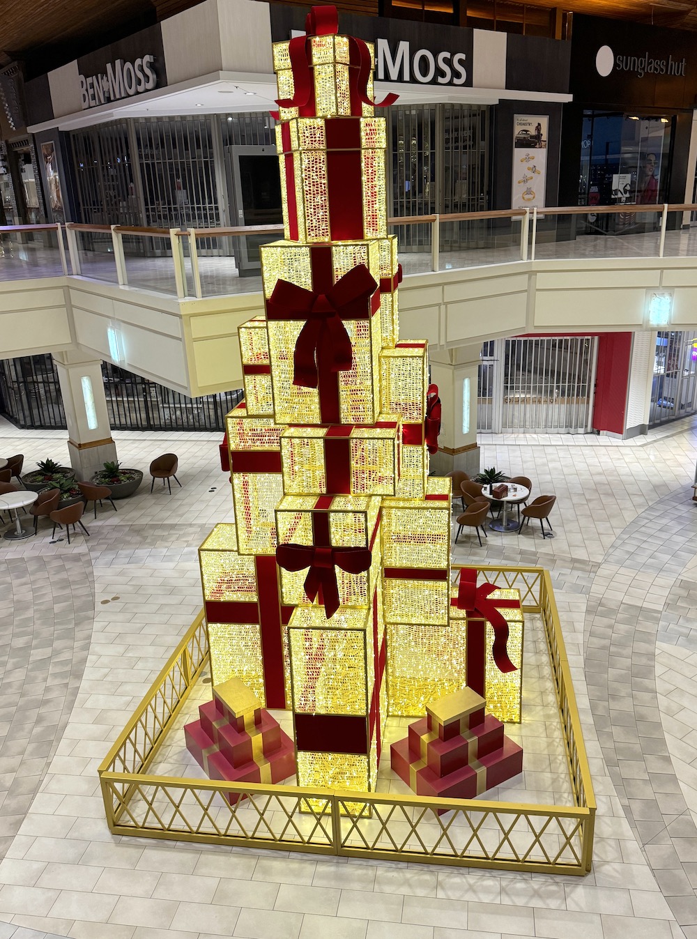 Greenscape Design's Illuminated Present Tower at Coquitlam Centre Court shines brightly, adding festive charm to the holiday decor.