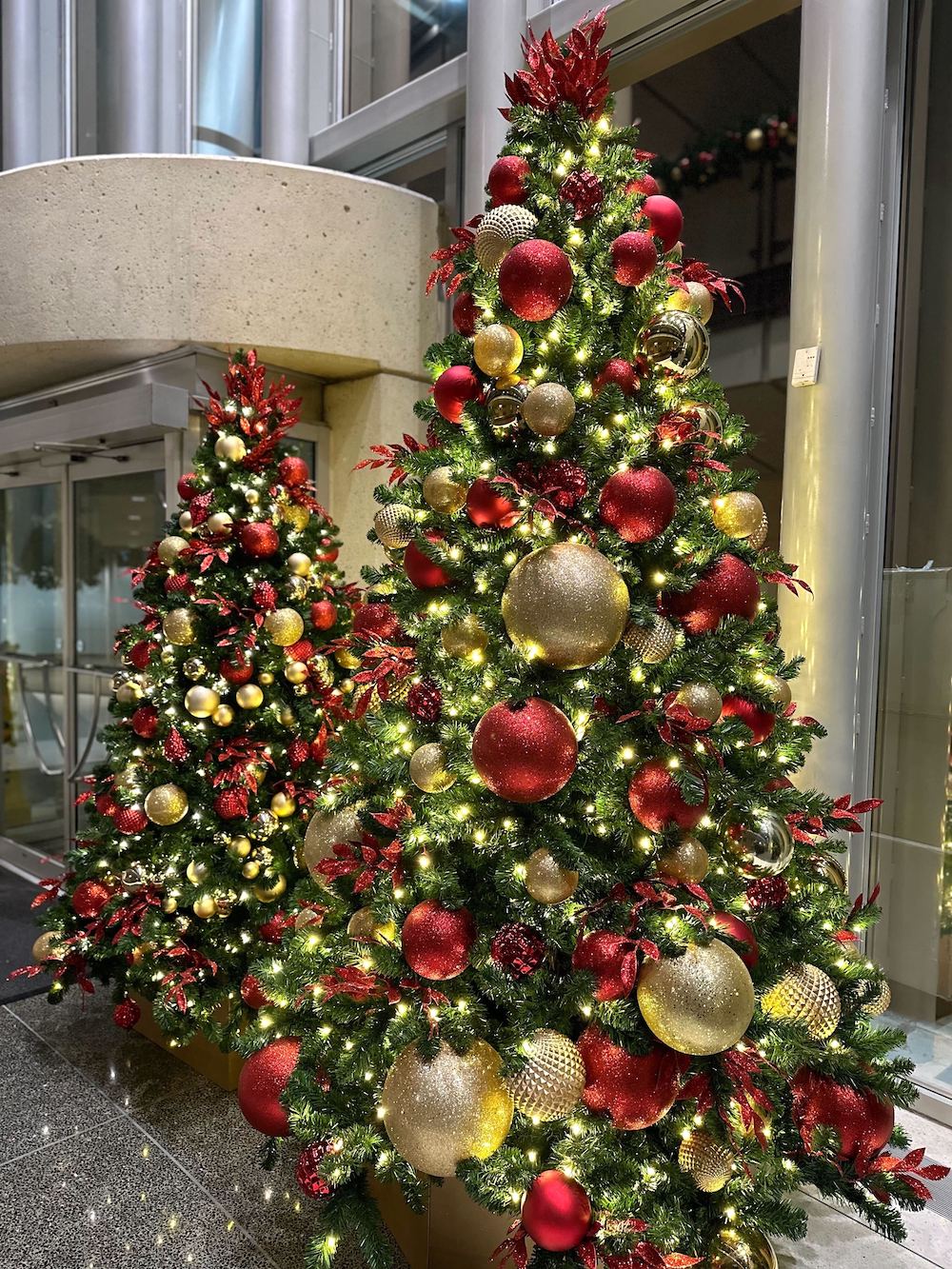 Greenscape Design's modern interpretation of a traditional red and gold Christmas tree brings a standout, eye-catching appeal to commercial office spaces.