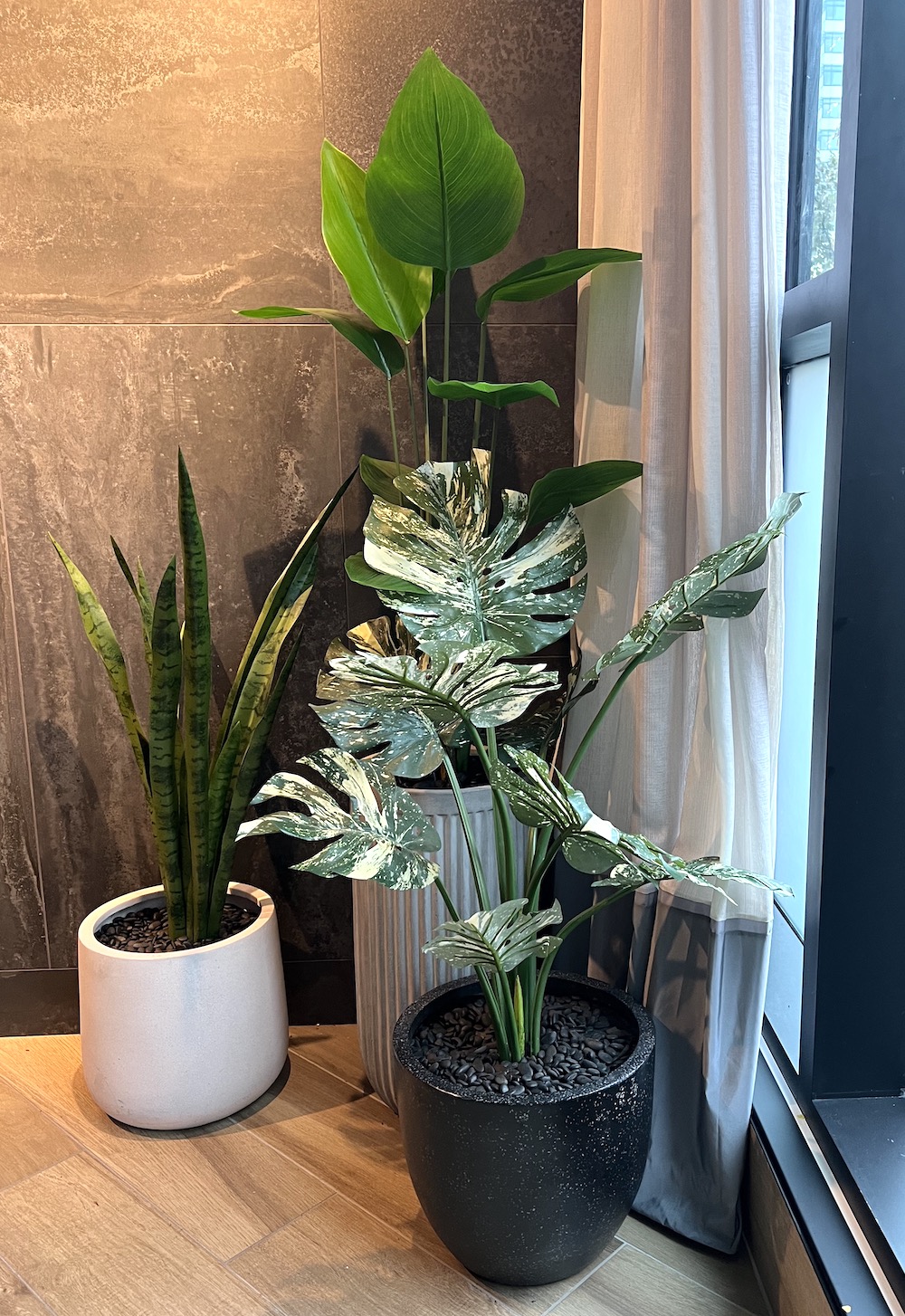 Artificial tropical plants in decorative planters at Moxie's Restaurant, provided by Greenscape Design.