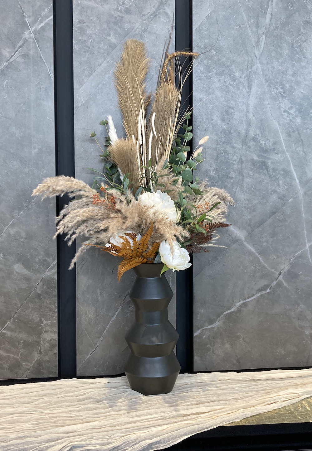 Pampas Grass and Dried Floral arrangement on a counter top by Greenscape Design in Vancouver.