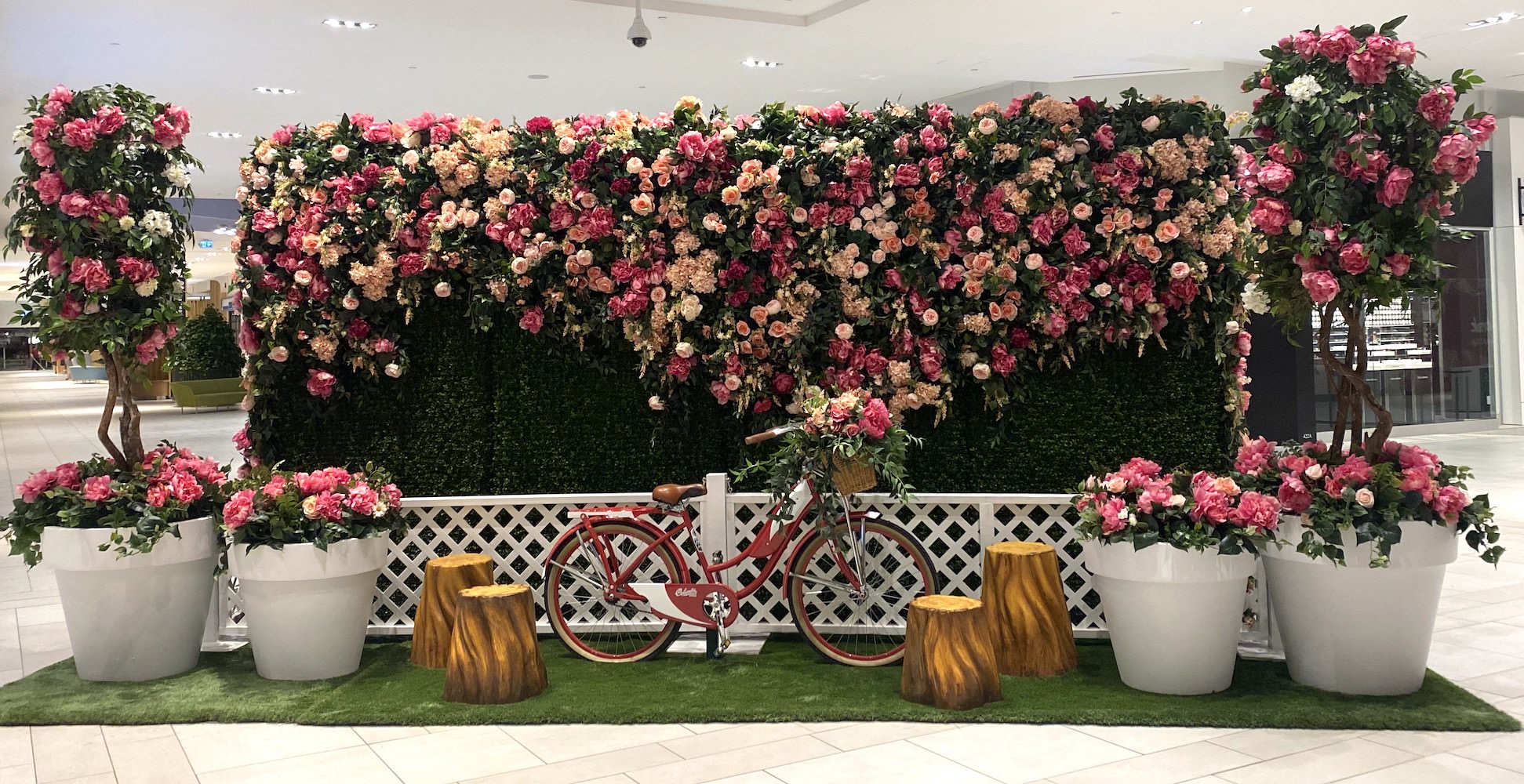 Greenscape Design's Easter display at Willowbrook Shopping Centre features a stunning floral wall and peony bushes, creating the perfect backdrop for photos.