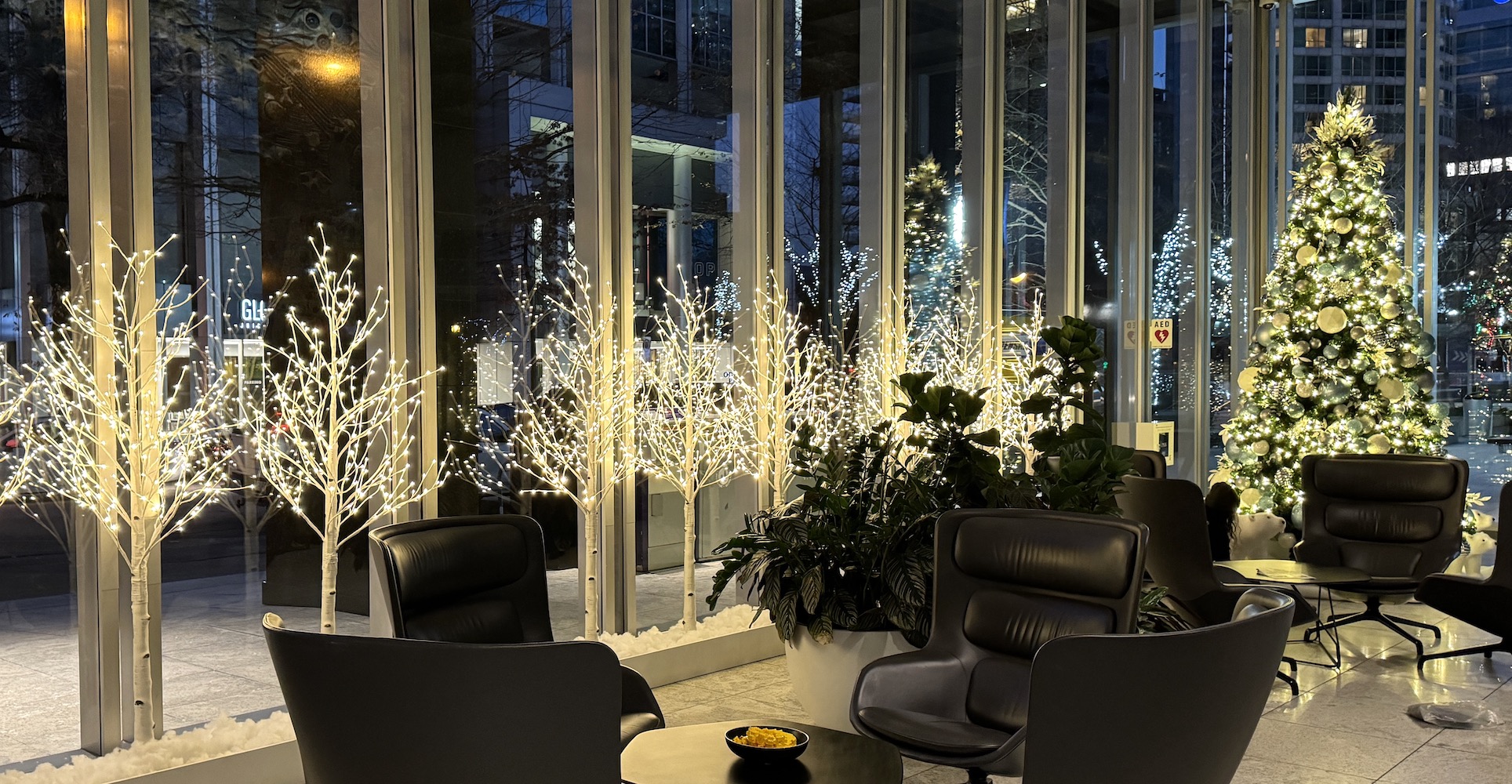 White birch LED trees line the front windows of a downtown office building owned by Oxford Properties. A Tower christmas tree decorated in a icy blue colour theme is featured by the entrance.