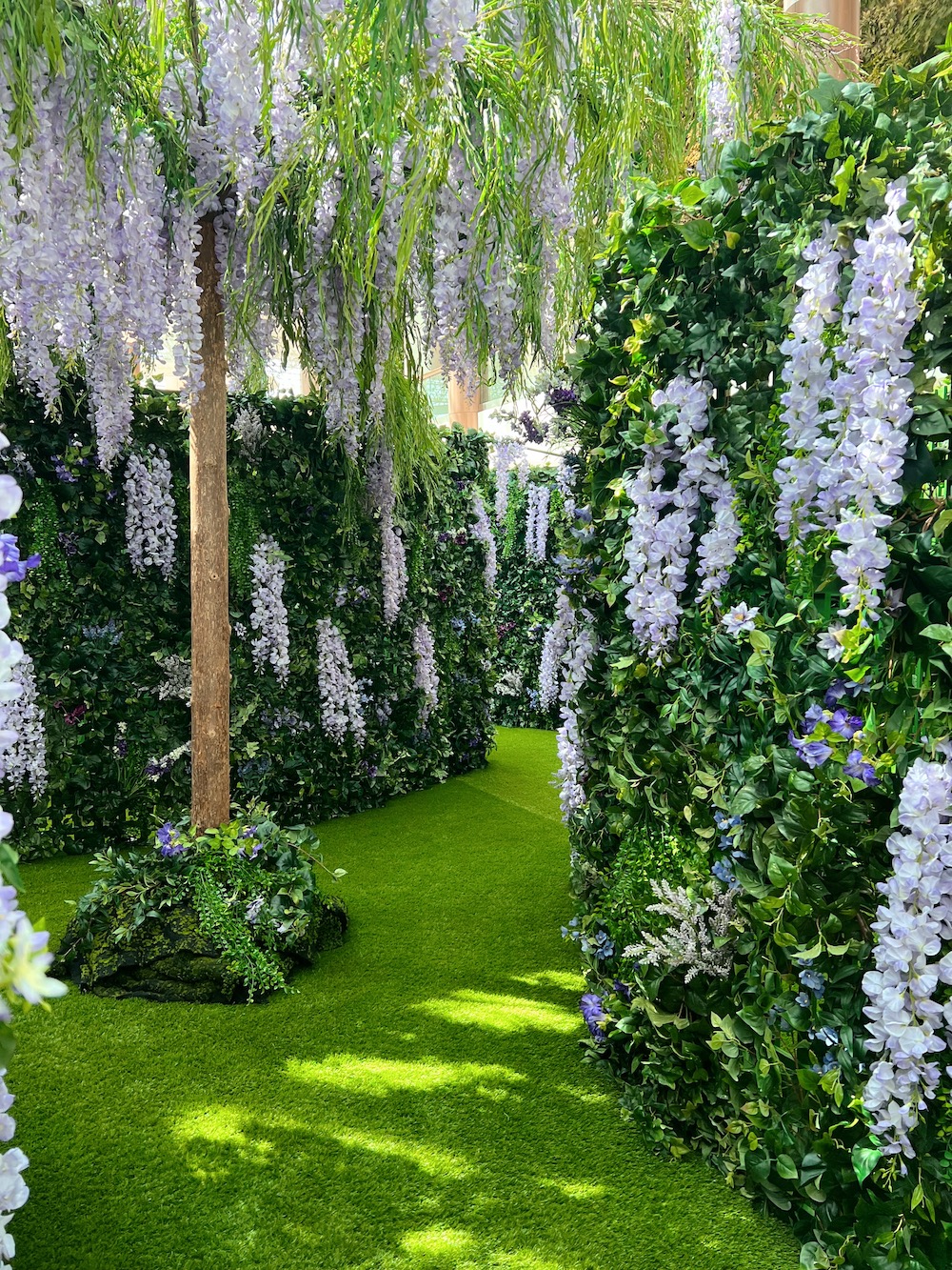 Wisteria tree and green wall maze created by Greenscape Design for a captivating Mother's Day experience at Guildford Shopping Centre