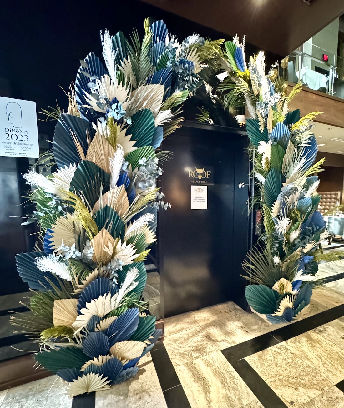 Custom arch rental by Greenscape Design in Vancouver, featuring preserved, dried, and paper florals for event décor.