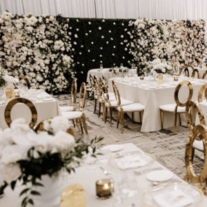 Greenscape Design luxe ombre faux floral wall with cascading white, cream, and blush artificial flowers at an elegant wedding reception in Vancouver.