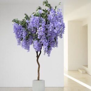 Artificial purple wisteria tree in a white planter with cascading blossoms.