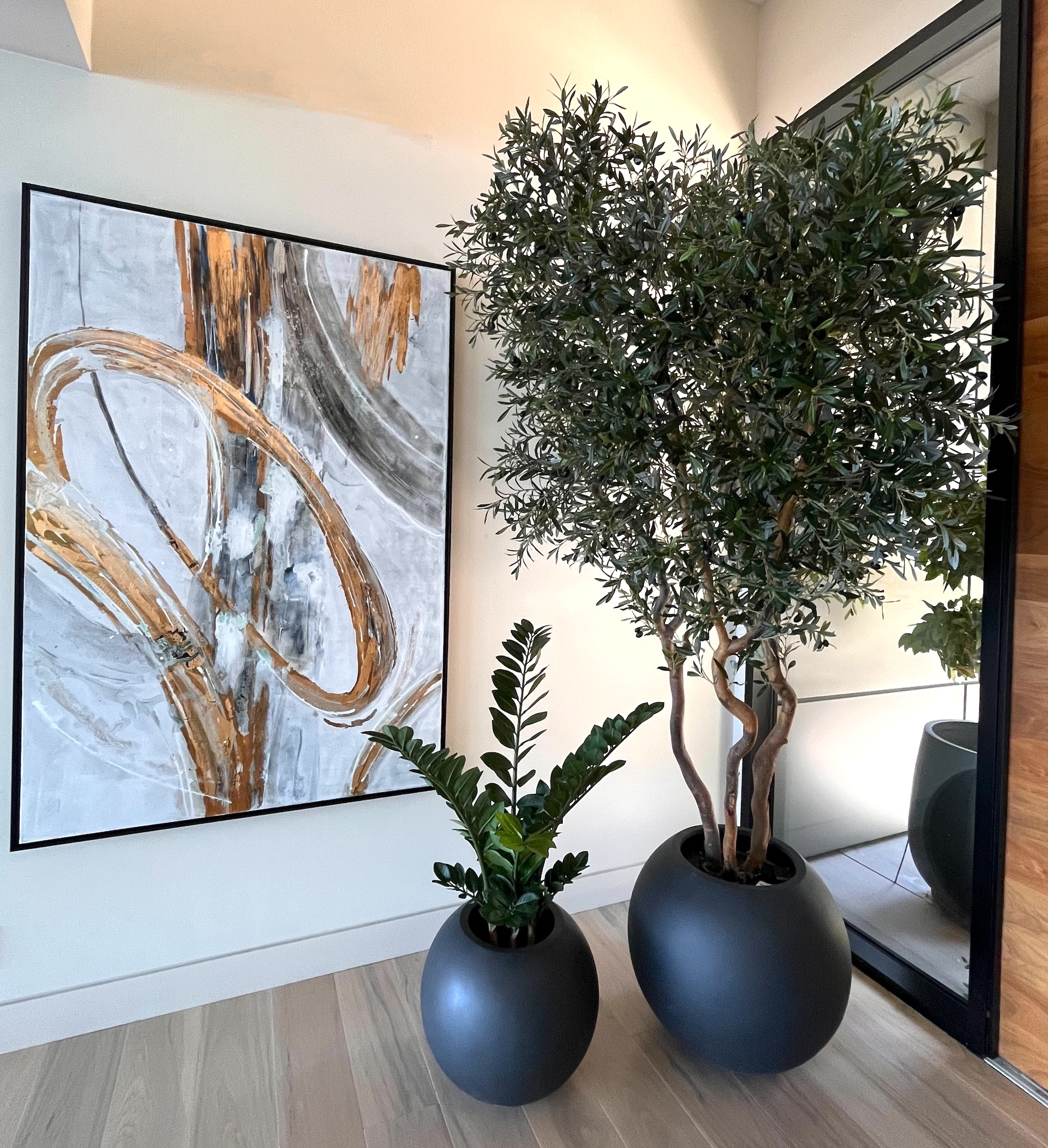 Artificial olive tree in planter for interior space