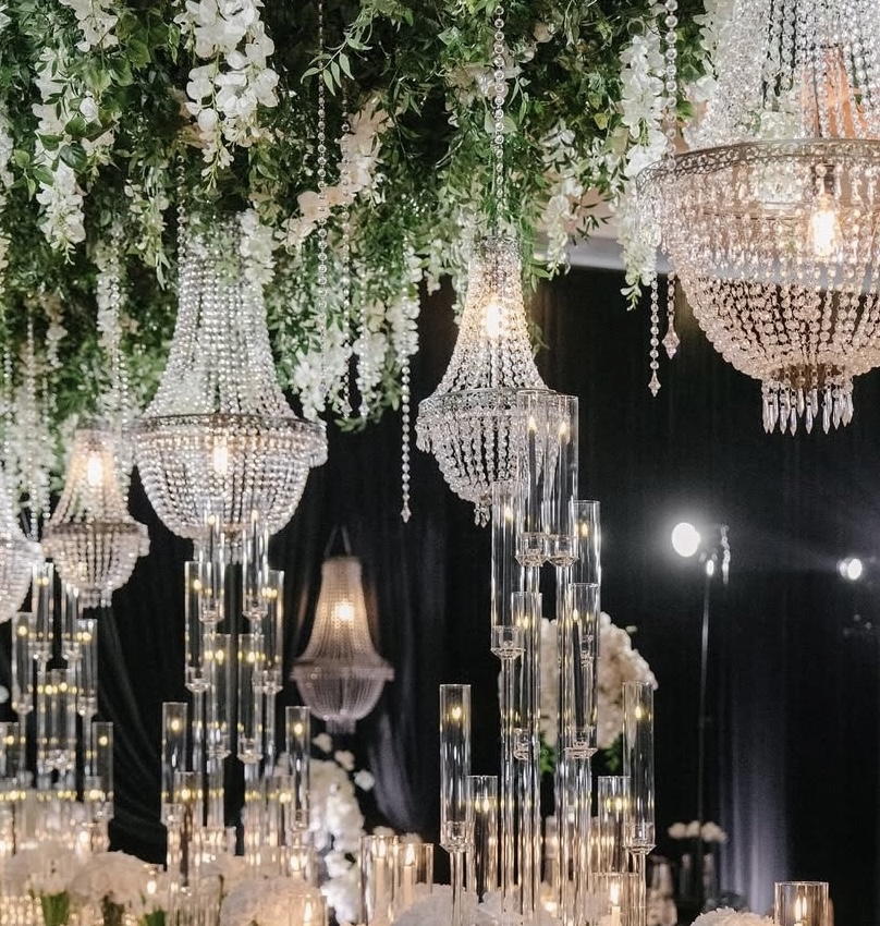 Luxury wedding reception with hanging wisteria and greenery chandeliers
