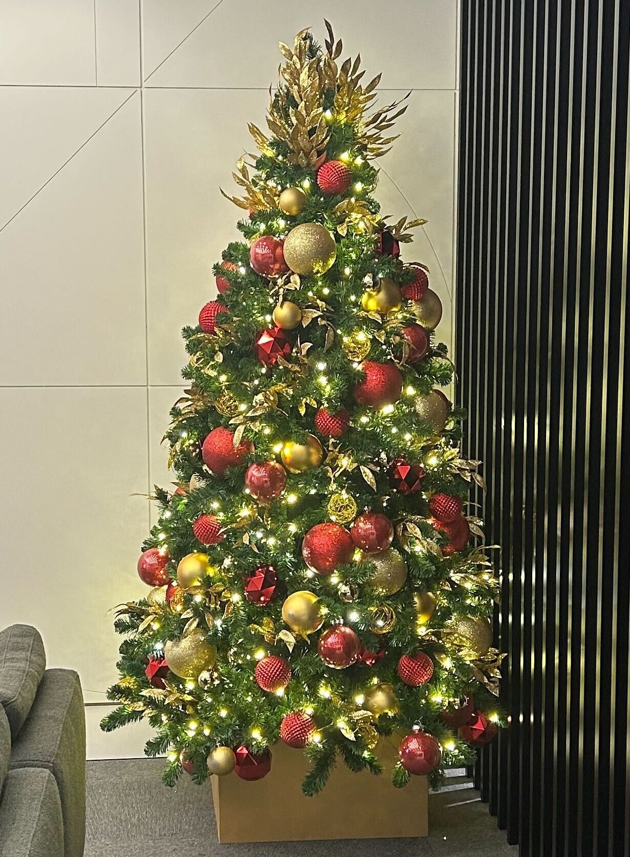 Decorated Christmas tree in condo lobby.