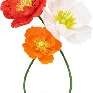 Oversized faux poppy flower props in red, orange, and white with sculptural green stems for event rentals.