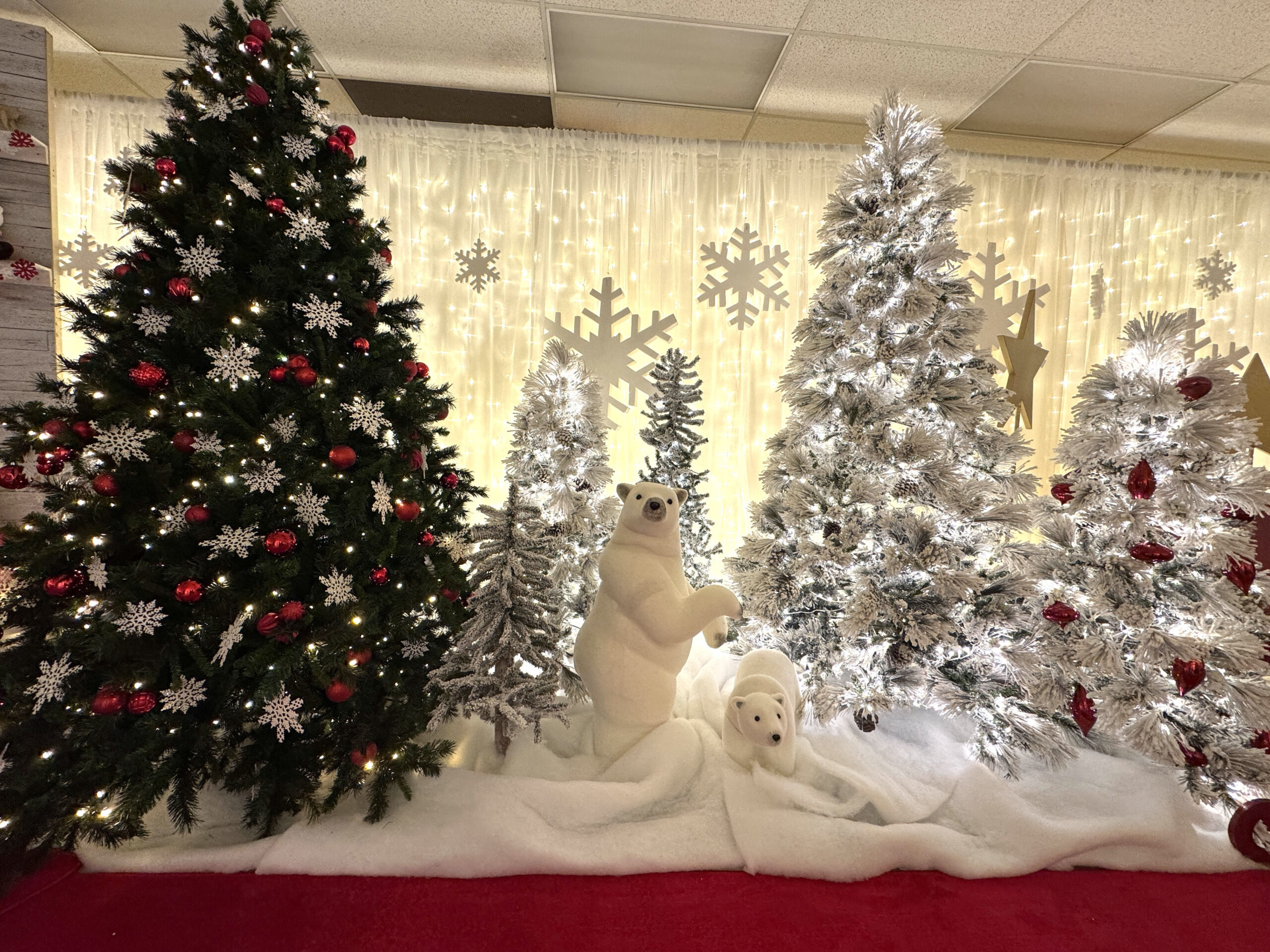Polar bear winter Christmas display with artificial trees