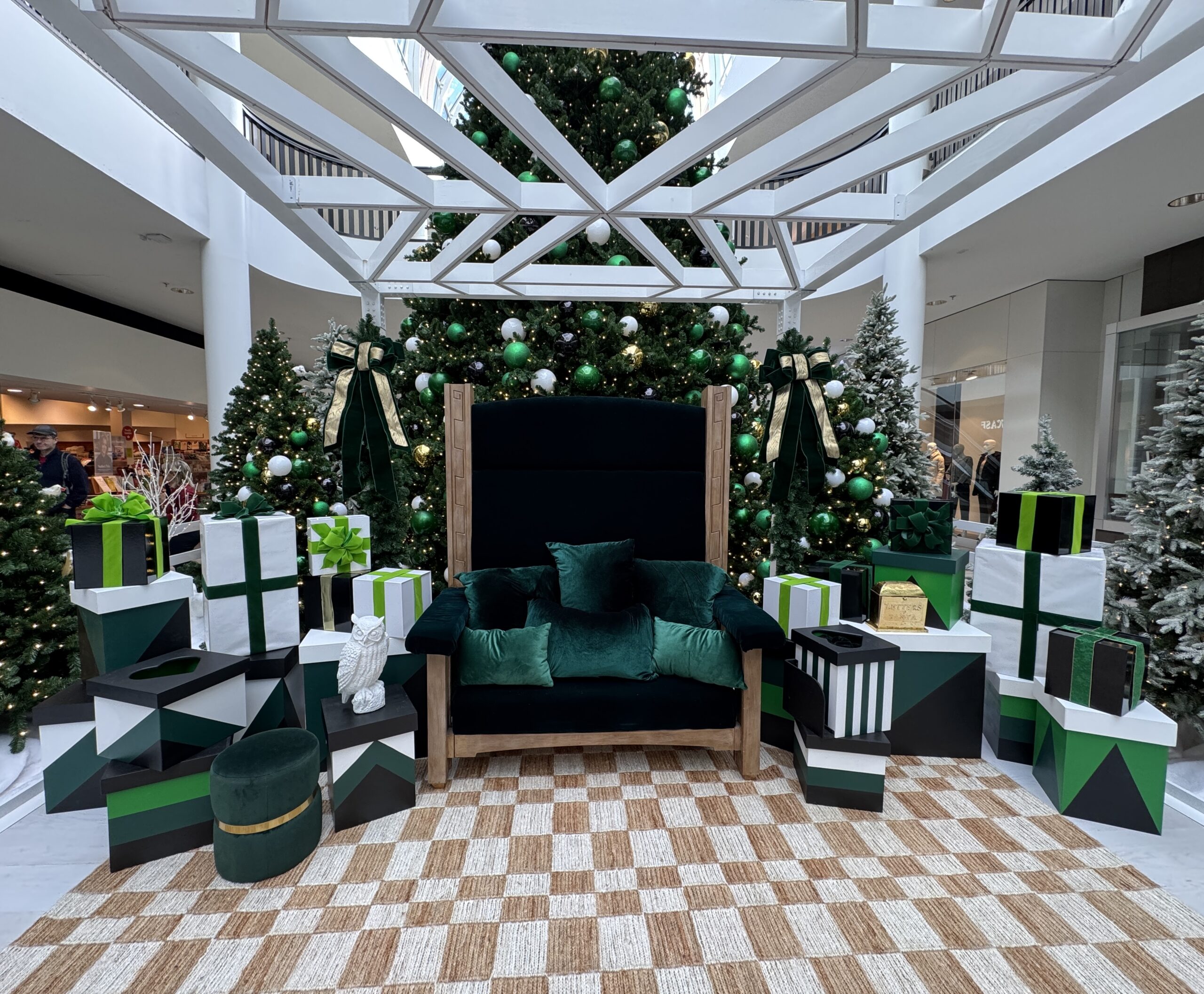 Modern green and white Santa set with oversize Santa Chair and Christmas trees