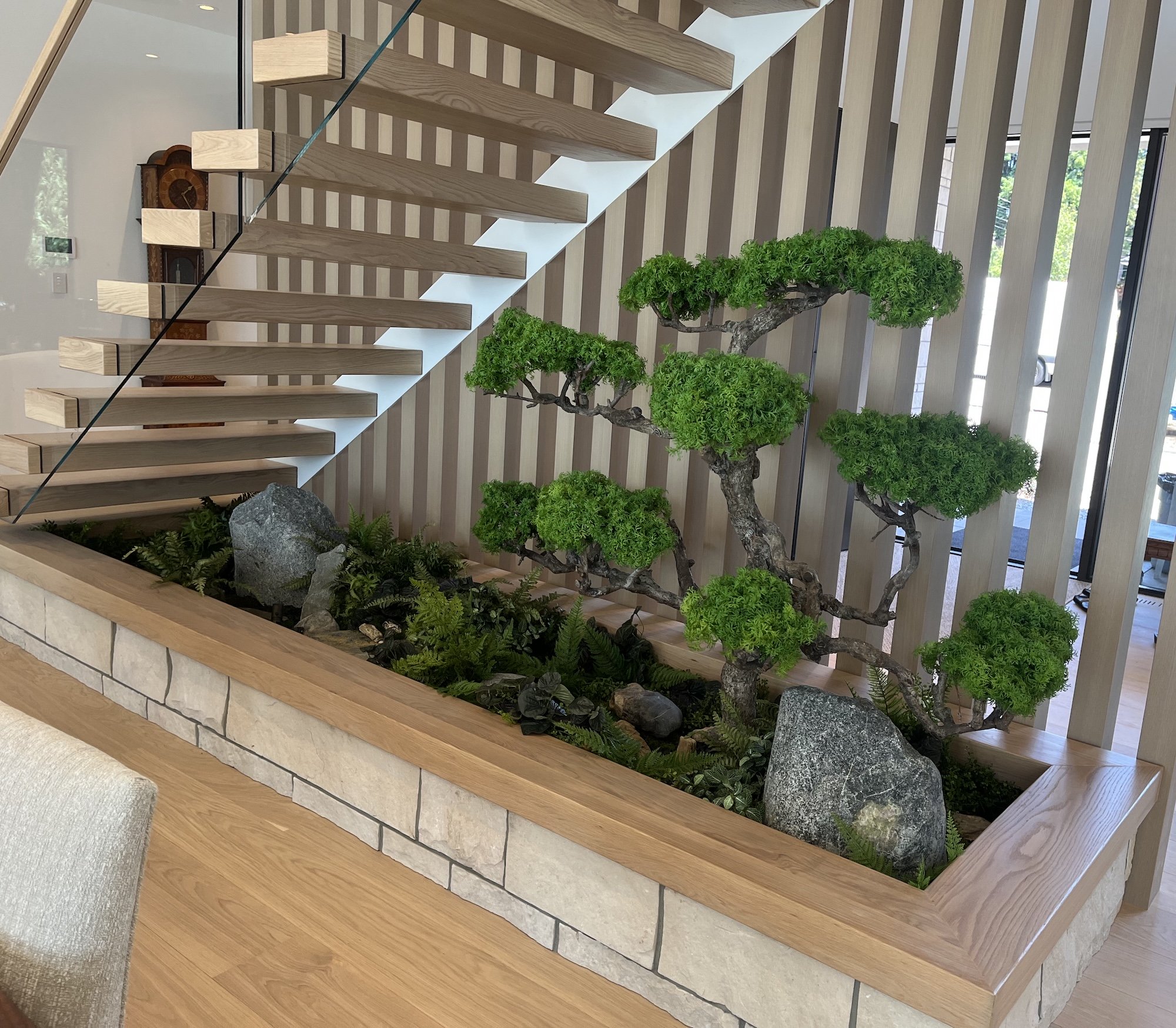 Faux bonsai tree displayed in interior setting