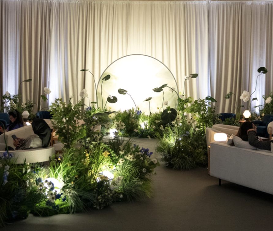 Glowing garden backdrop with soft lighting and floral elements