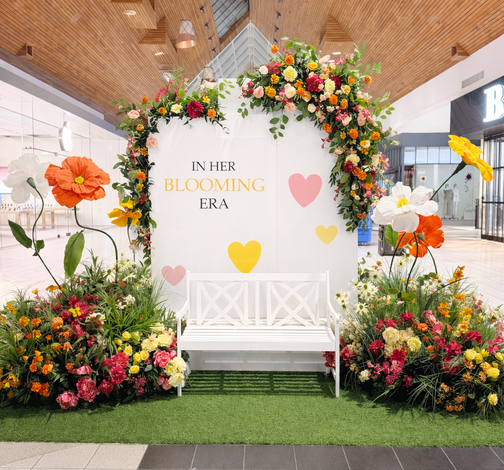 Mother’s Day spring floral display with colourful flowers and backdrop