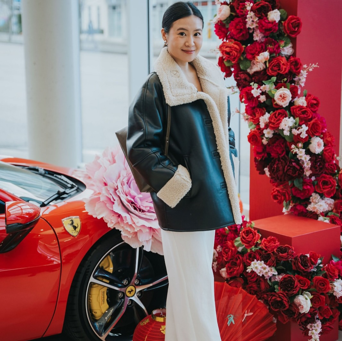 Red floral pillar display with luxury event styling