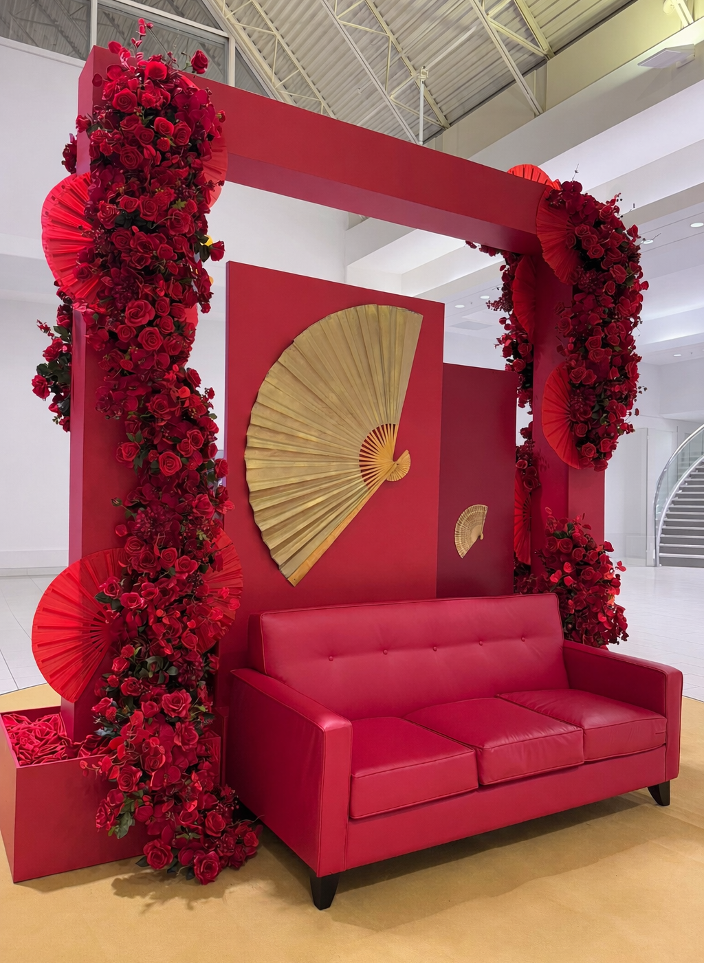 Red rose arch with gold fan detail for Lunar New Year display