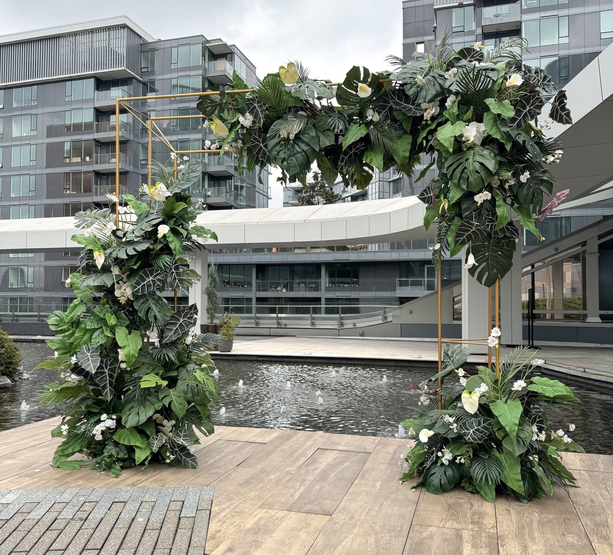 Tropical greenery arch with lush foliage for outdoor event