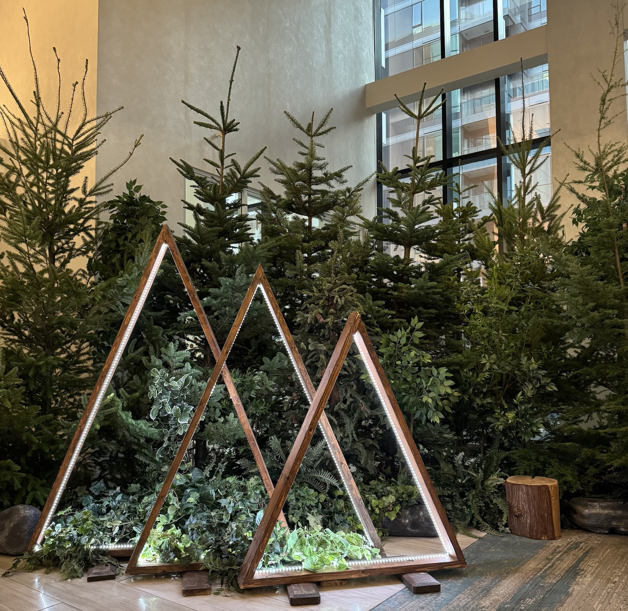 Evergreen tree backdrop with west coast forest styling for event
