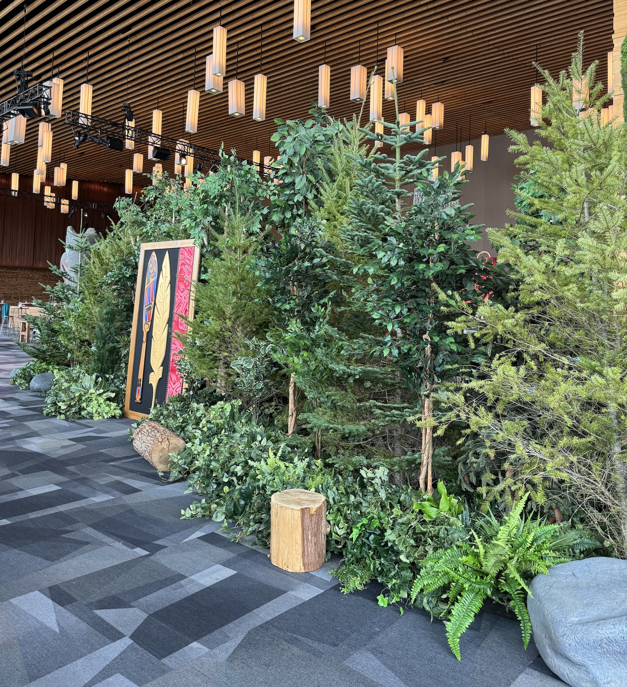 West coast evergreen forest wall with live trees for event backdrop