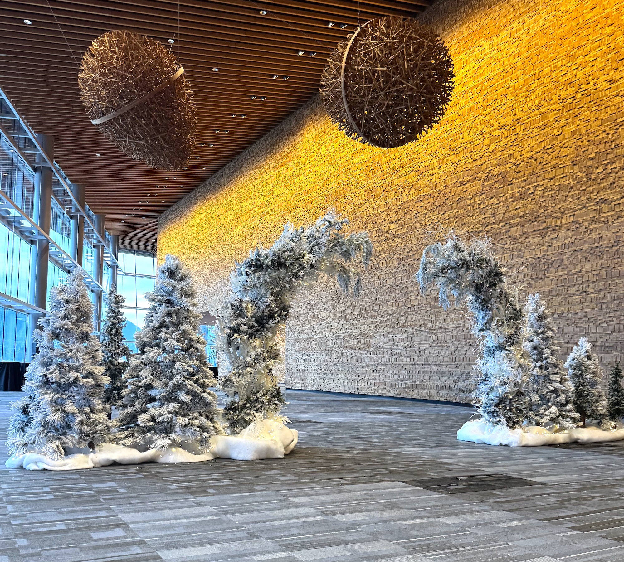 Snow-covered winter forest entry arch with frosted trees